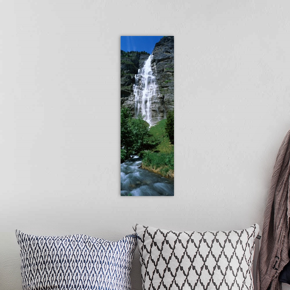 A bohemian room featuring Waterfall in a forest Murrenbach Falls Lauterbrunnen Valley Bernese Oberland Berne Canton Switzer...