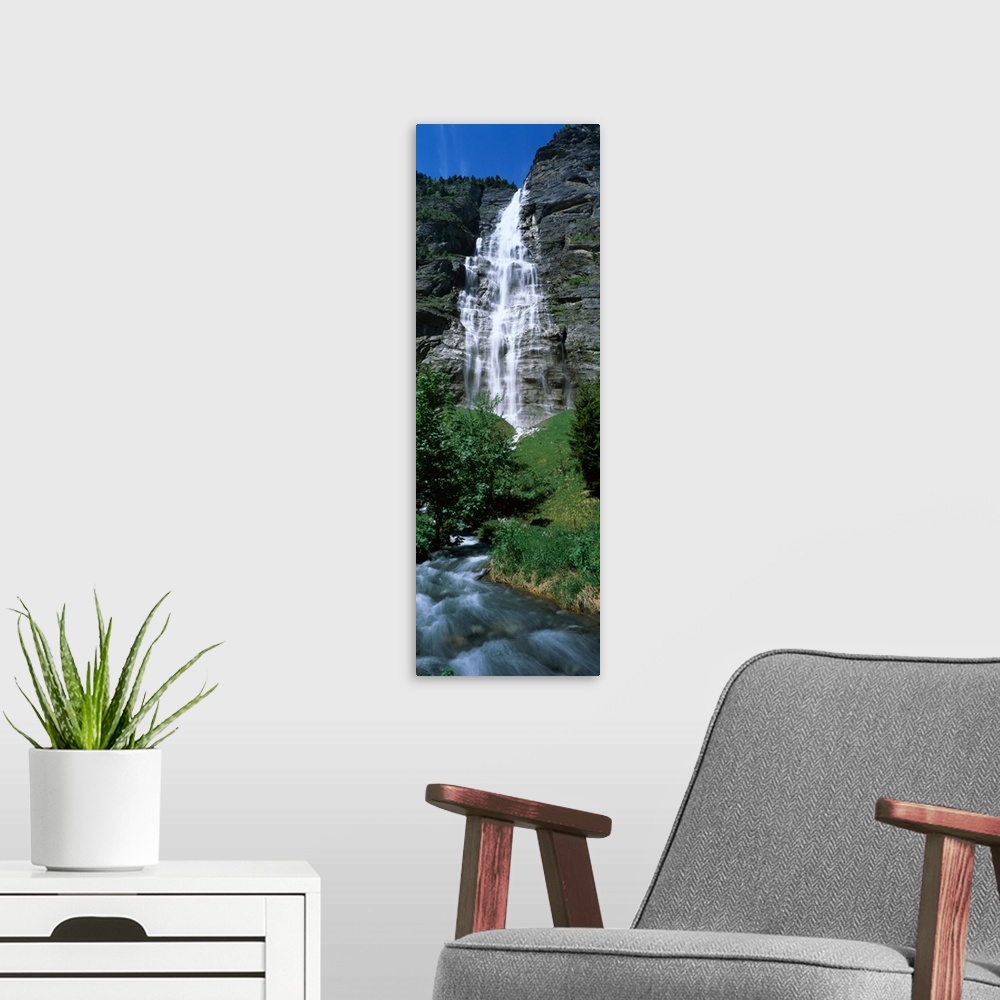 A modern room featuring Waterfall in a forest Murrenbach Falls Lauterbrunnen Valley Bernese Oberland Berne Canton Switzer...