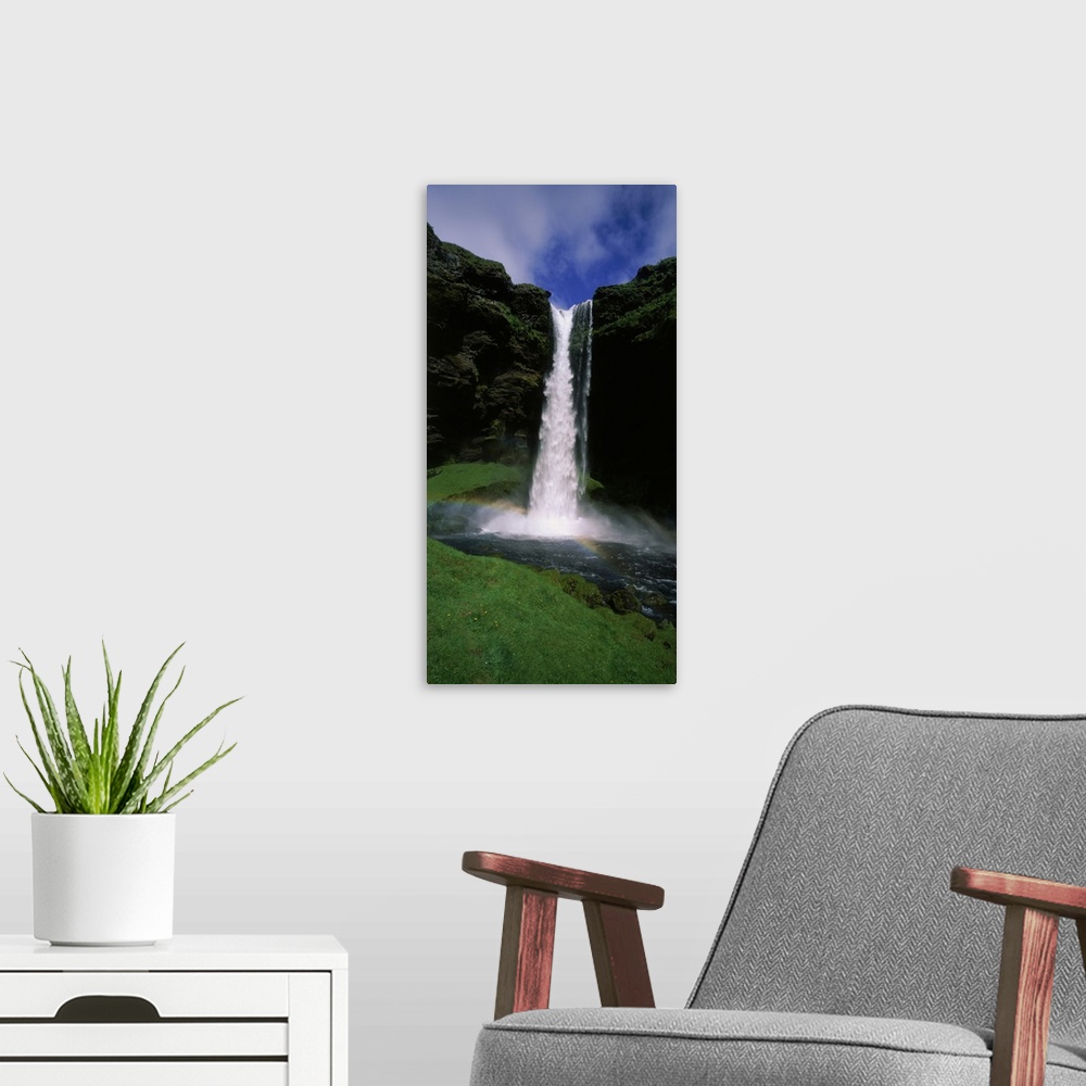 A modern room featuring Waterfall in the forest, Kvernufoss, Iceland