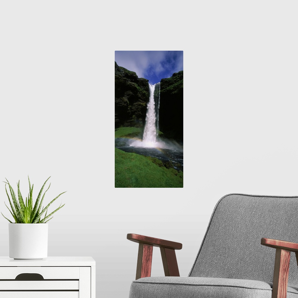A modern room featuring Waterfall in the forest, Kvernufoss, Iceland