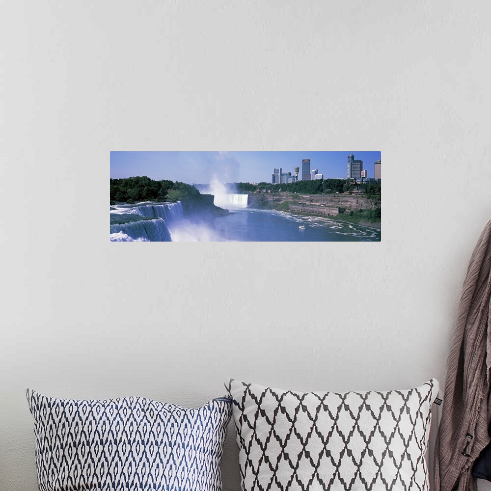 A bohemian room featuring Panoramic photograph of the three waterfalls that straddle the international border between Canad...