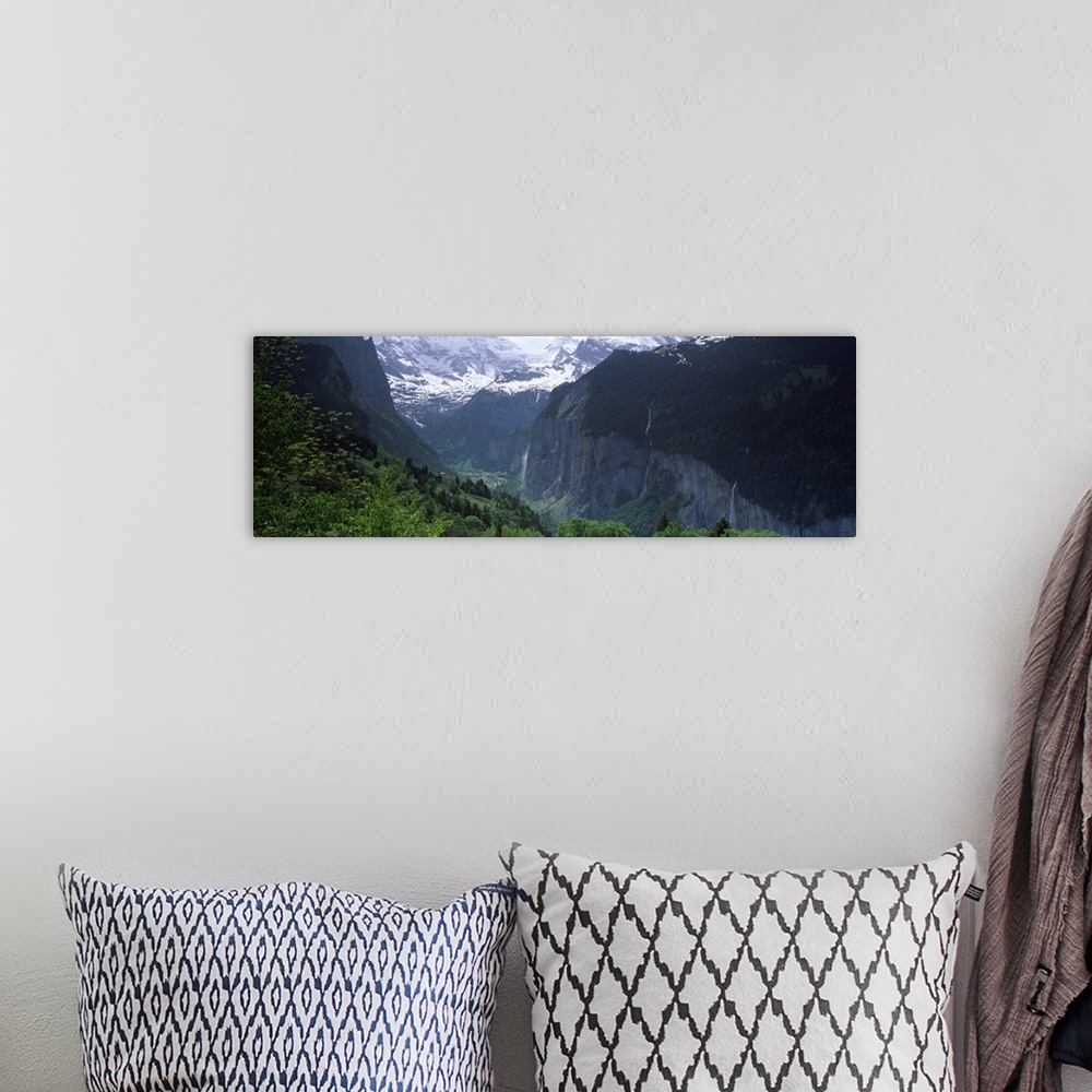 A bohemian room featuring Waterfalls in a forest Lauterbrunnen Valley Wengen Bernese Oberland Berne Canton Switzerland