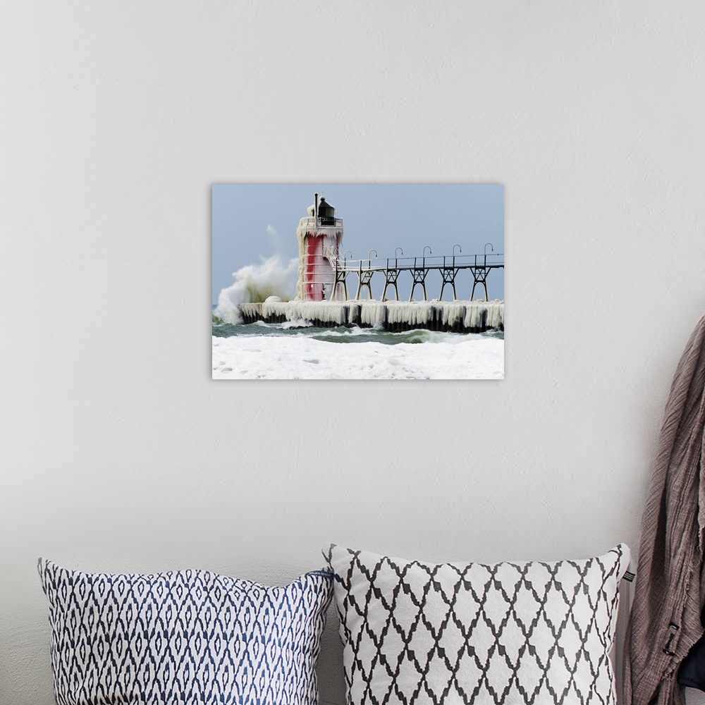 A bohemian room featuring Wave crashing on snow-covered South Pier lighthouse, South Haven, Michigan