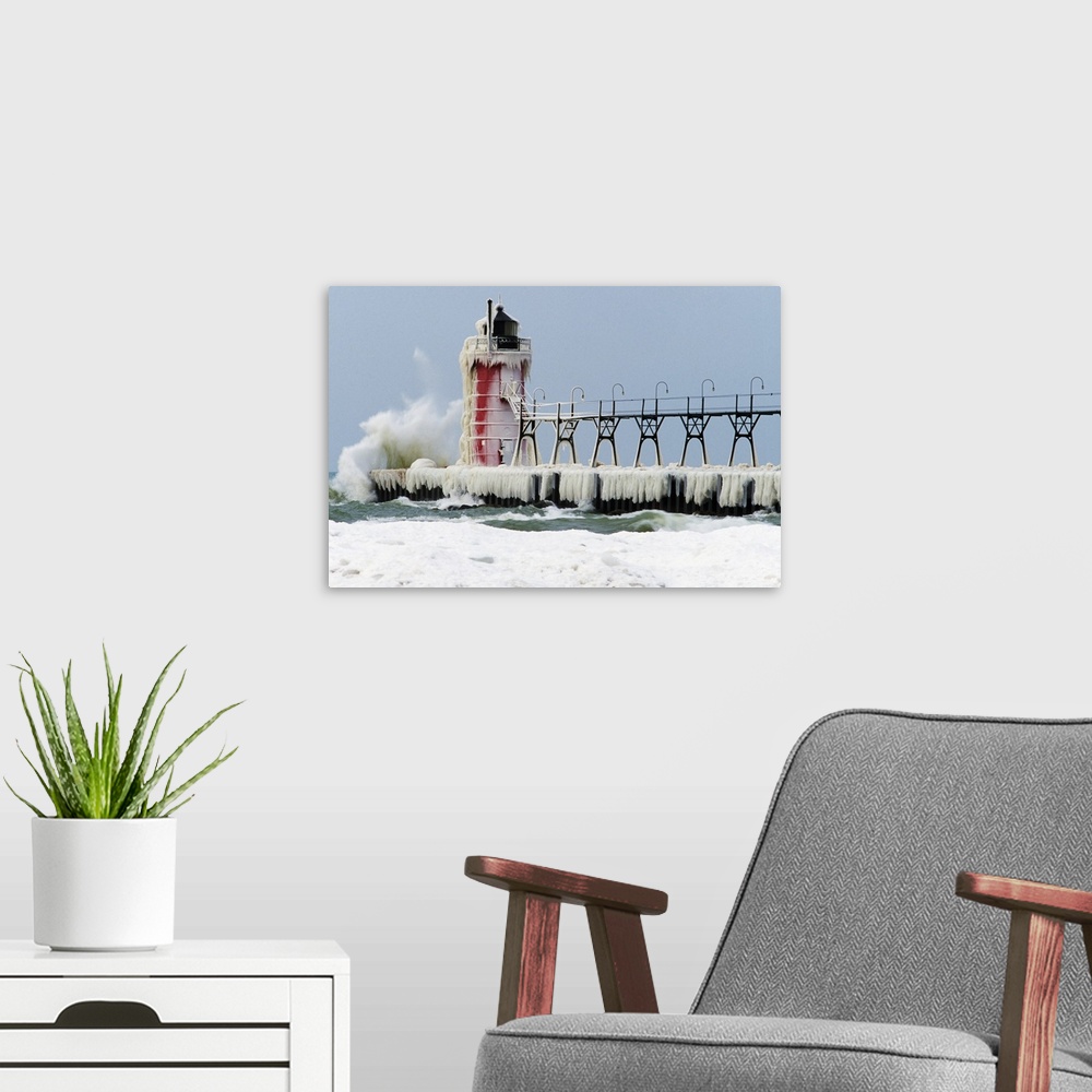 A modern room featuring Wave crashing on snow-covered South Pier lighthouse, South Haven, Michigan