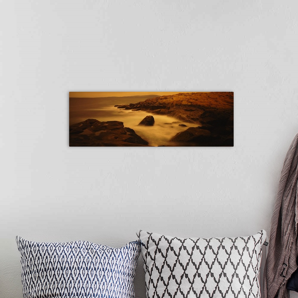 A bohemian room featuring Large photograph of misty waters surrounding rocks in the Acadia National Park on the Schoodic Pe...
