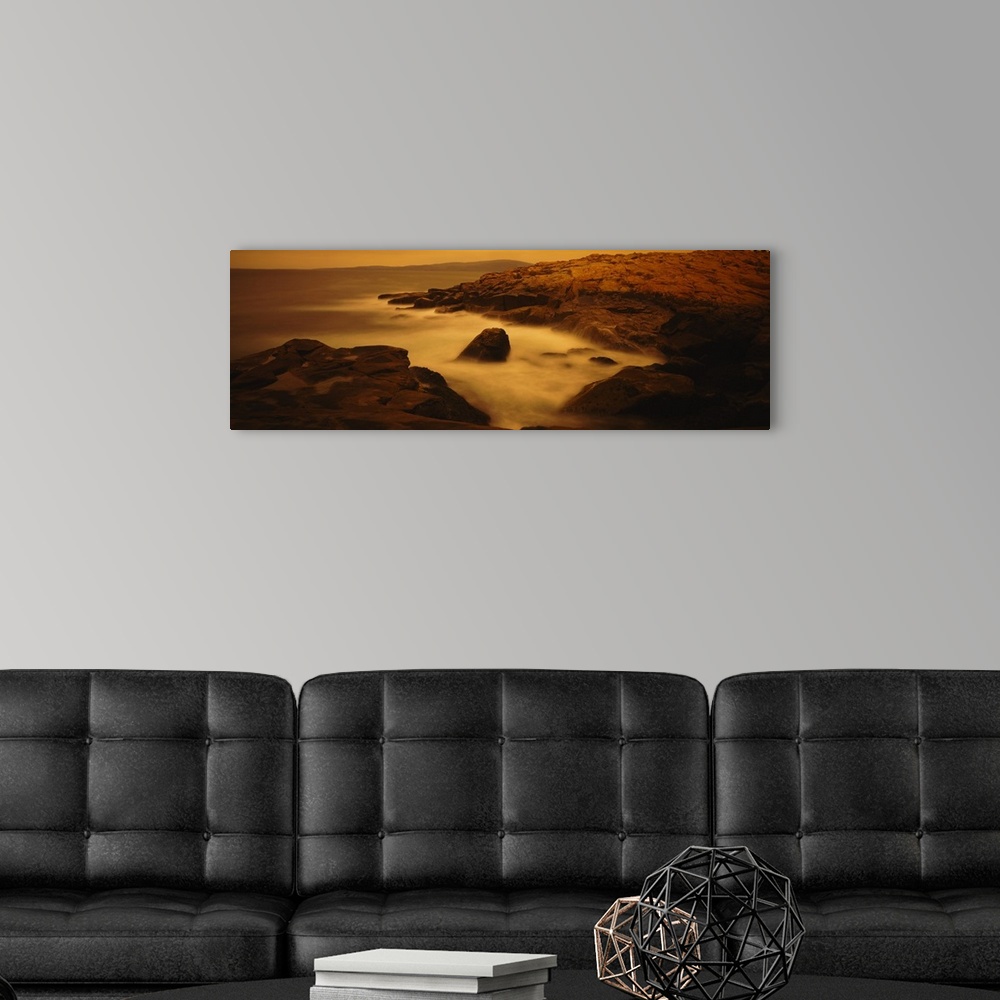 A modern room featuring Large photograph of misty waters surrounding rocks in the Acadia National Park on the Schoodic Pe...