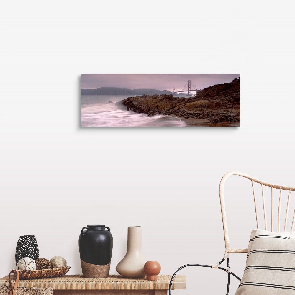 A farmhouse room featuring Panoramic photograph shows waves breaking against the rocky shores of Baker Beach in San Francisc...
