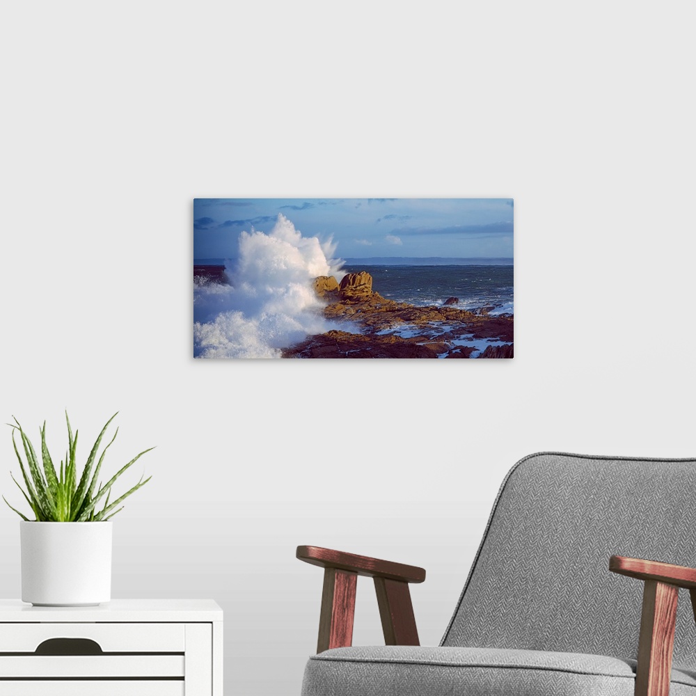A modern room featuring Waves crashing on rocks at wild coast, Saint-Guenole, Morbihan, Brittany, France