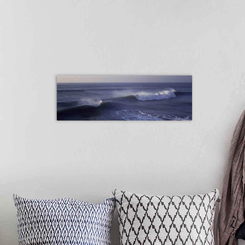 A bohemian room featuring Long horizontal photo on canvas of waves crashing in the Pacific Ocean.