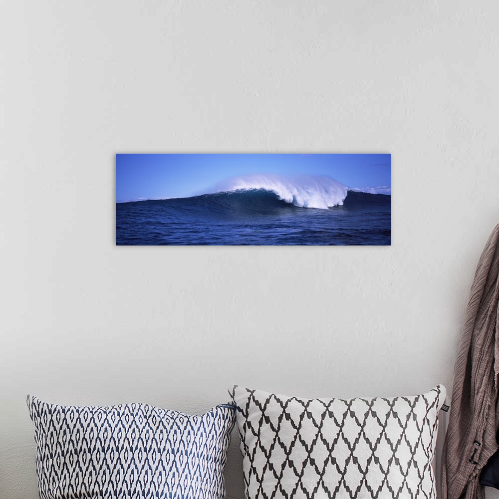 A bohemian room featuring Long canvas photo of a big wave crashing in the ocean.