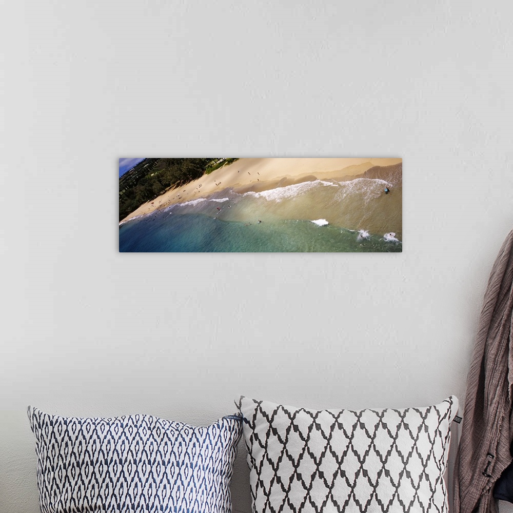 A bohemian room featuring Long photo on canvas of ocean waves crashing on the shore of a Hawaiian beach.