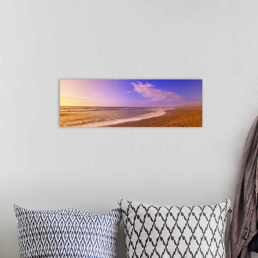 A bohemian room featuring Oversized, landscape photograph of waves hitting the sands of North Beach, on Point Reyes Nationa...