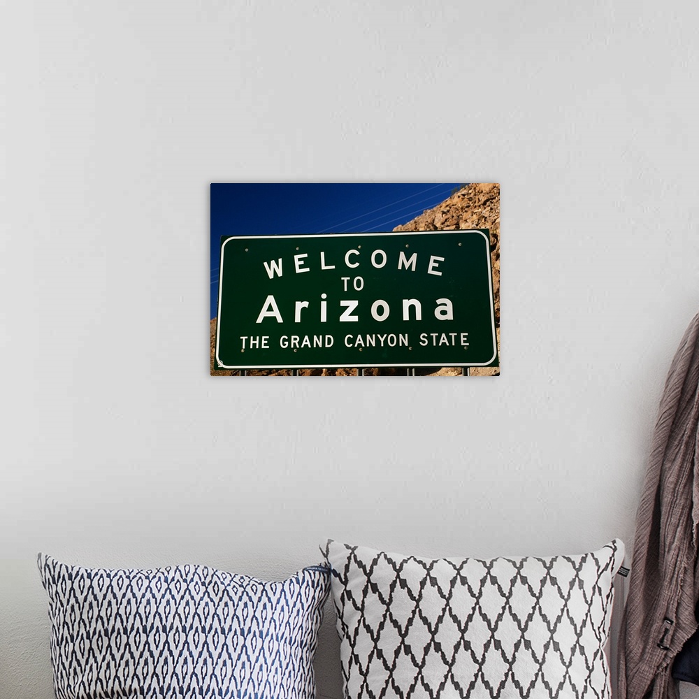 A bohemian room featuring Welcome to Arizona State Sign