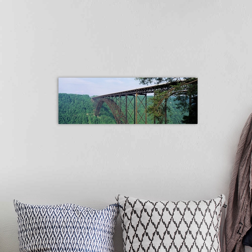 A bohemian room featuring Panoramic photograph of a dense forest of trees surrounding the base of New River Gorge Bridge in...