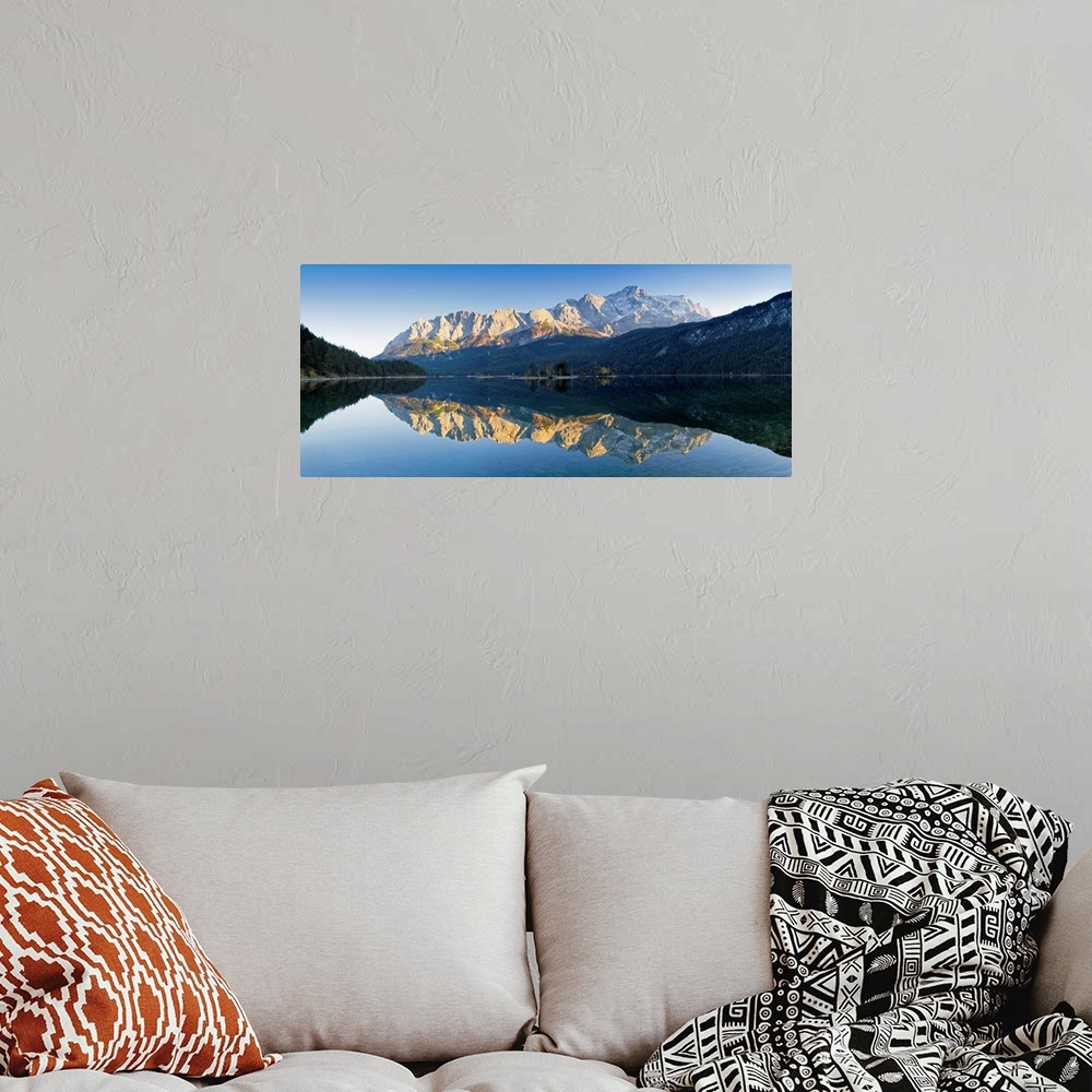 A bohemian room featuring Wetterstein Mountains and Zugspitze Mountain reflecting in Lake Eibsee, Bavaria, Germany