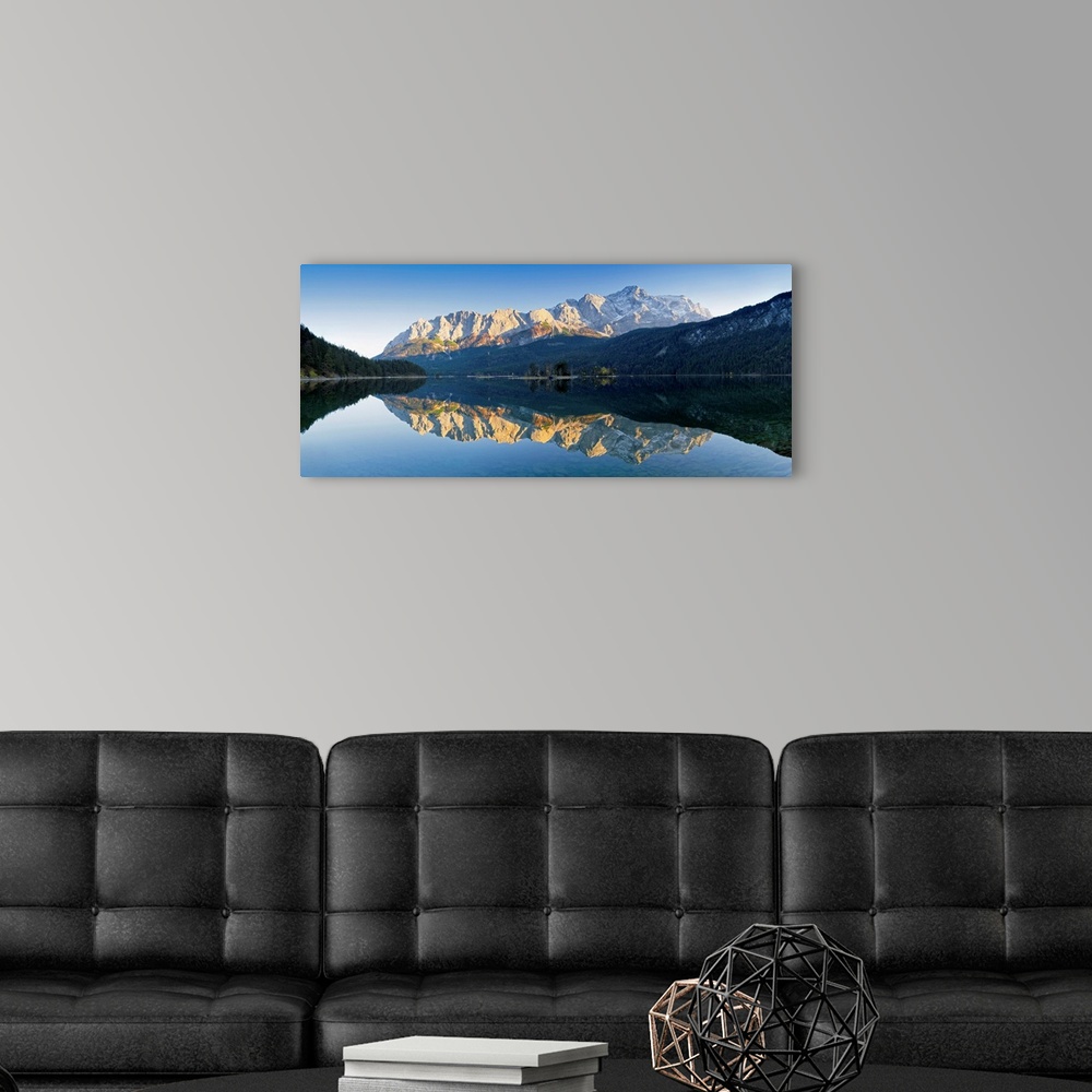 A modern room featuring Wetterstein Mountains and Zugspitze Mountain reflecting in Lake Eibsee, Bavaria, Germany