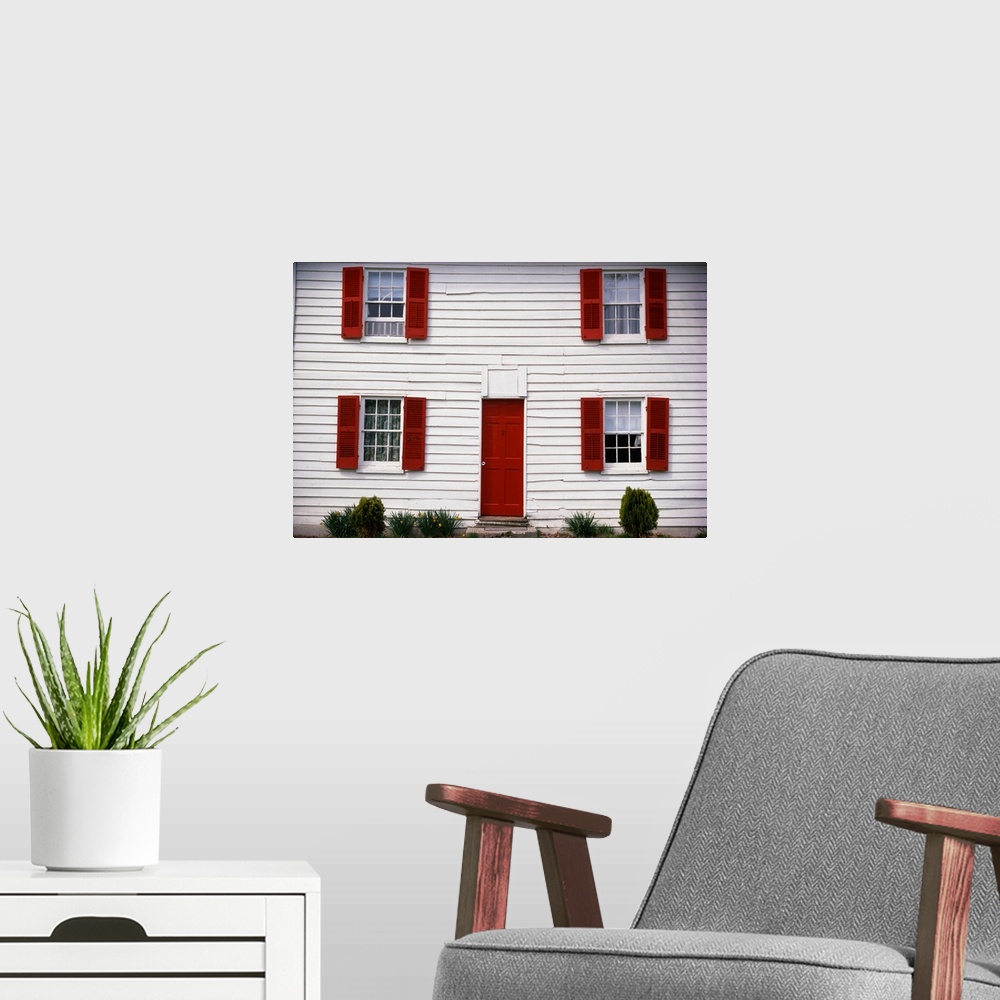 A modern room featuring White House with Red Door and Shutters
