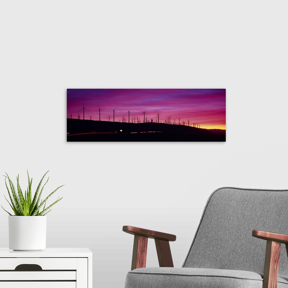 A modern room featuring Wind turbines in a row at dusk, Palm Springs, California