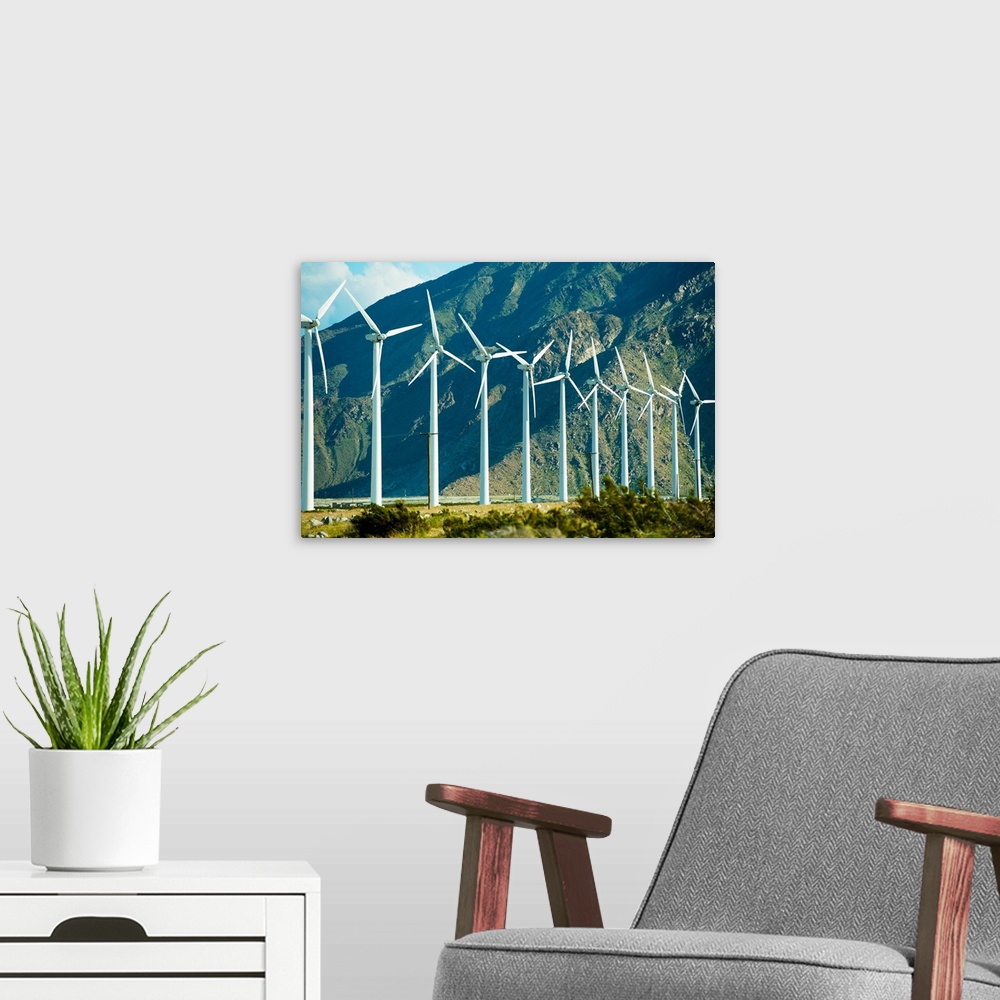 A modern room featuring Wind turbines in front of a mountain, Palm Springs, California