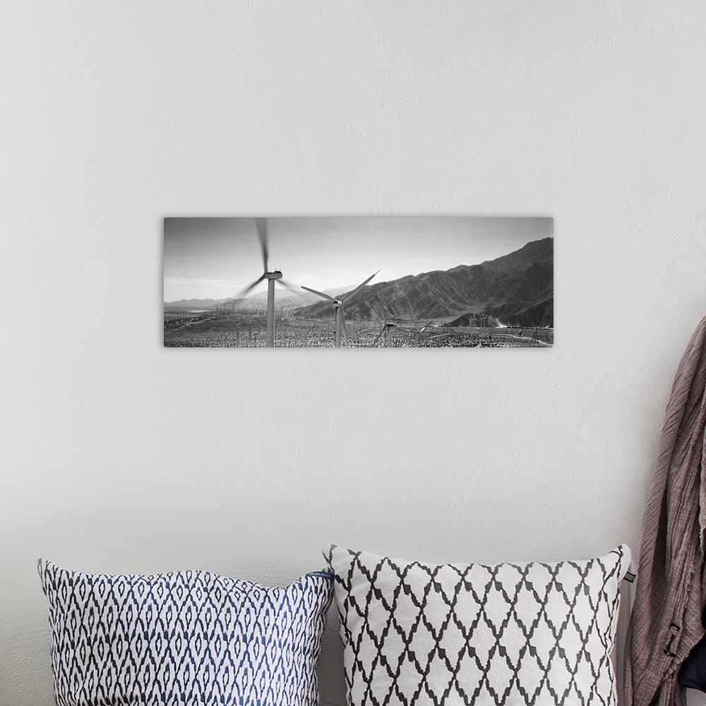 A bohemian room featuring Wind turbines on a landscape