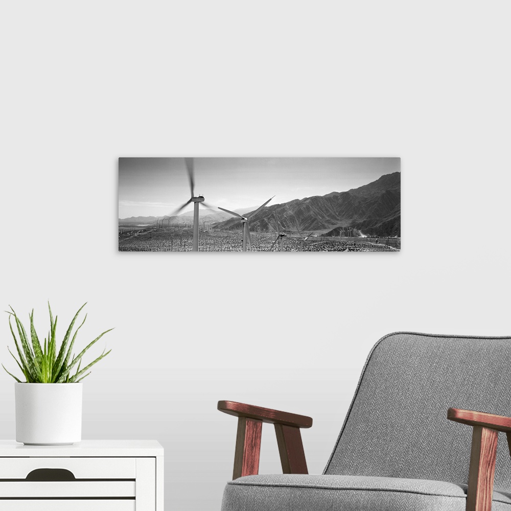 A modern room featuring Wind turbines on a landscape