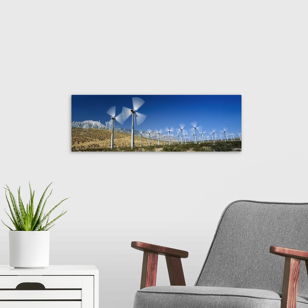 A modern room featuring Wind turbines spinning in a field, Palm Springs, California