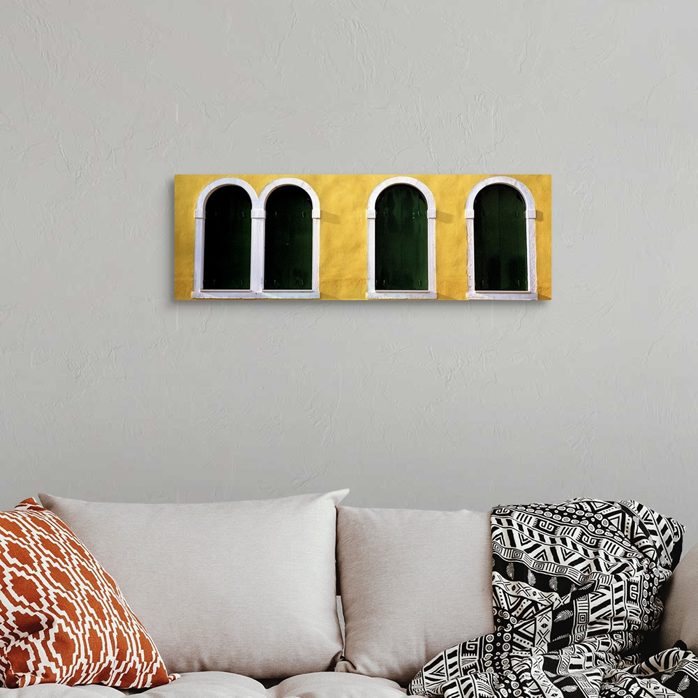 A bohemian room featuring Windows in Yellow Wall Venice Italy