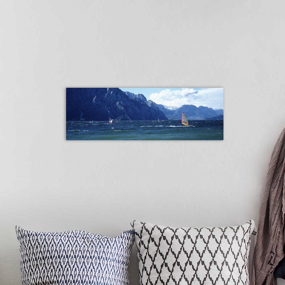 A bohemian room featuring Windsurfing on a lake, Lake Garda, Italy
