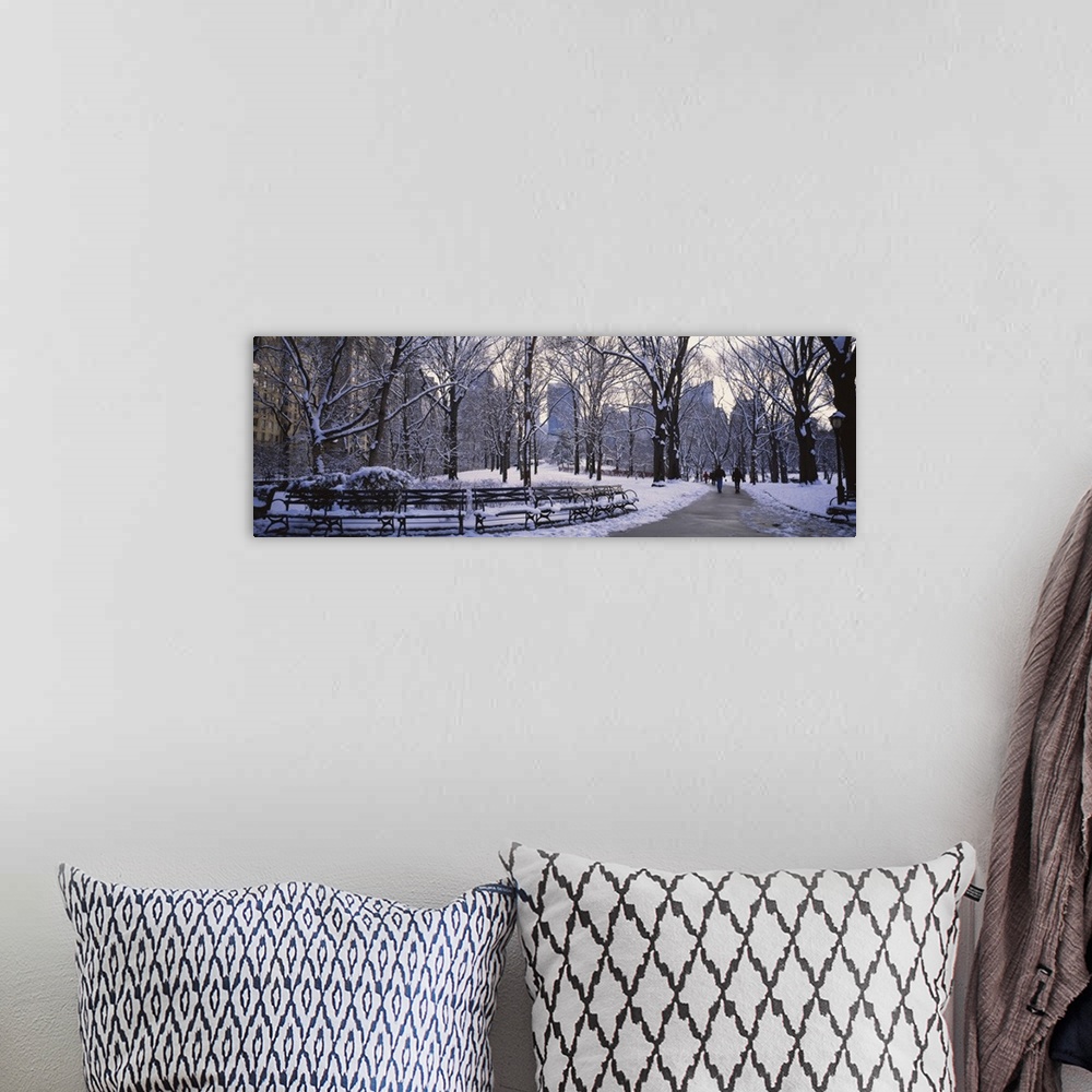 A bohemian room featuring Big, landscape photograph of New York's Central Park in the snow with downtown Manhattan in the b...