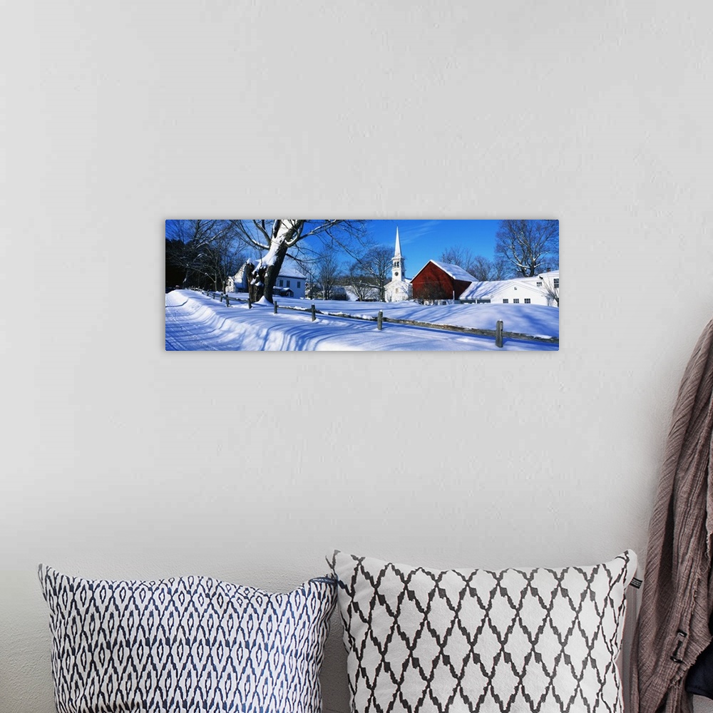 A bohemian room featuring Large, horizontal photograph of a snow covered landscape next to the road in Peacham, Vermont.  S...