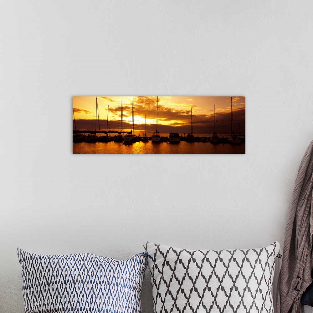 A bohemian room featuring Panoramic photograph of many boats in a line, docked in Egg Harbor beneath a vibrant setting sun,...