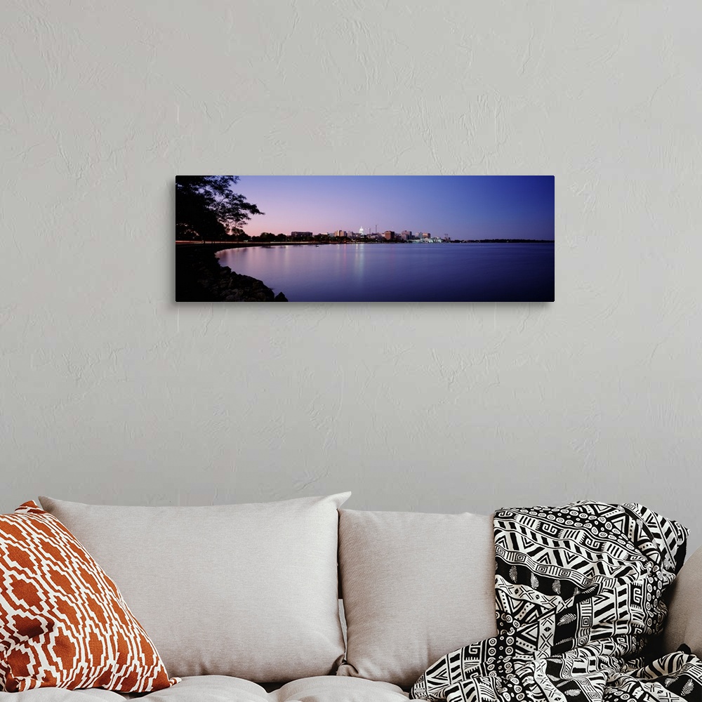 A bohemian room featuring Panoramic photo print of buildings in Madison on the waterfront lit up at dusk.
