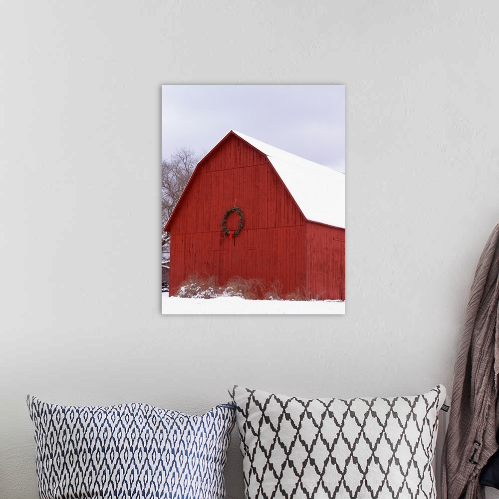 A bohemian room featuring Big photo on canvas of a farm building decorated for Christmas in the snow.