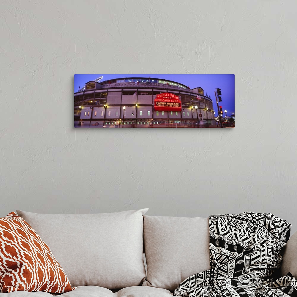 A bohemian room featuring Panoramic photograph of the outer walls and sign of Wrigley Field where the Chicago Cubs play bas...