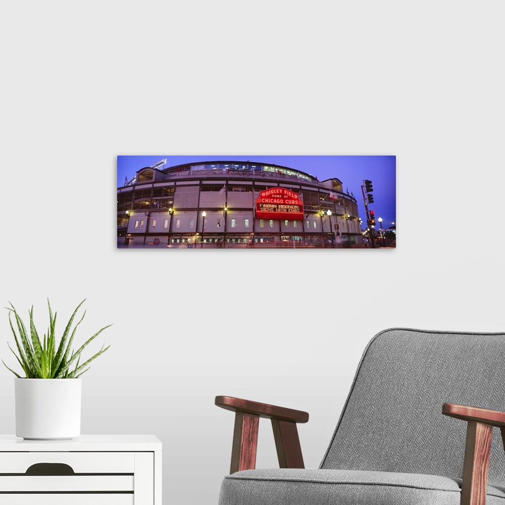 A modern room featuring Panoramic photograph of the outer walls and sign of Wrigley Field where the Chicago Cubs play bas...