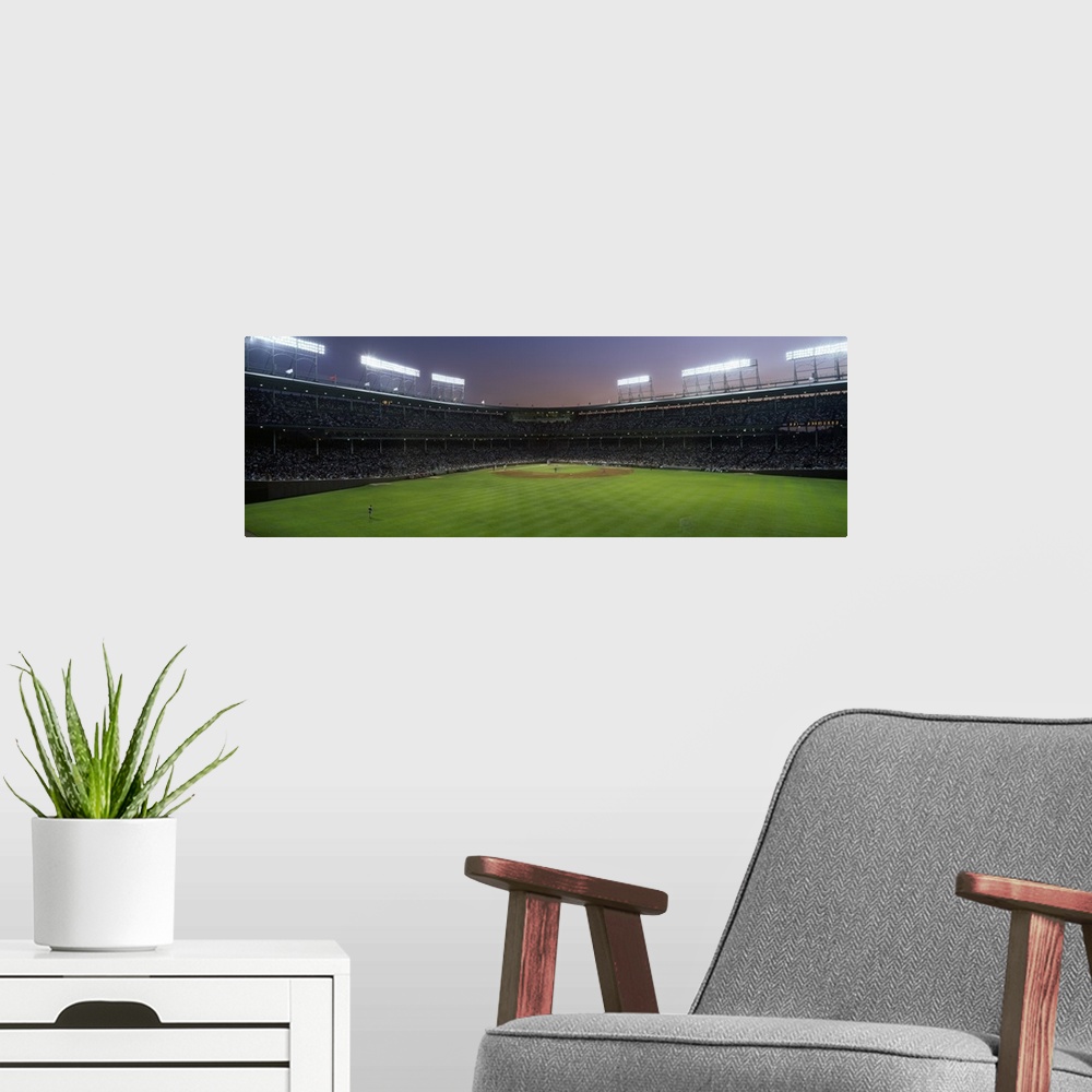 A modern room featuring Panoramic view the crowd and field at Wrigley field in Chicago, Illinois.