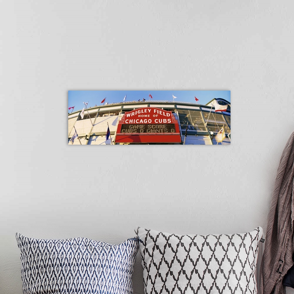 A bohemian room featuring Panoramic photograph of Chicago Bears baseball stadium entrance.