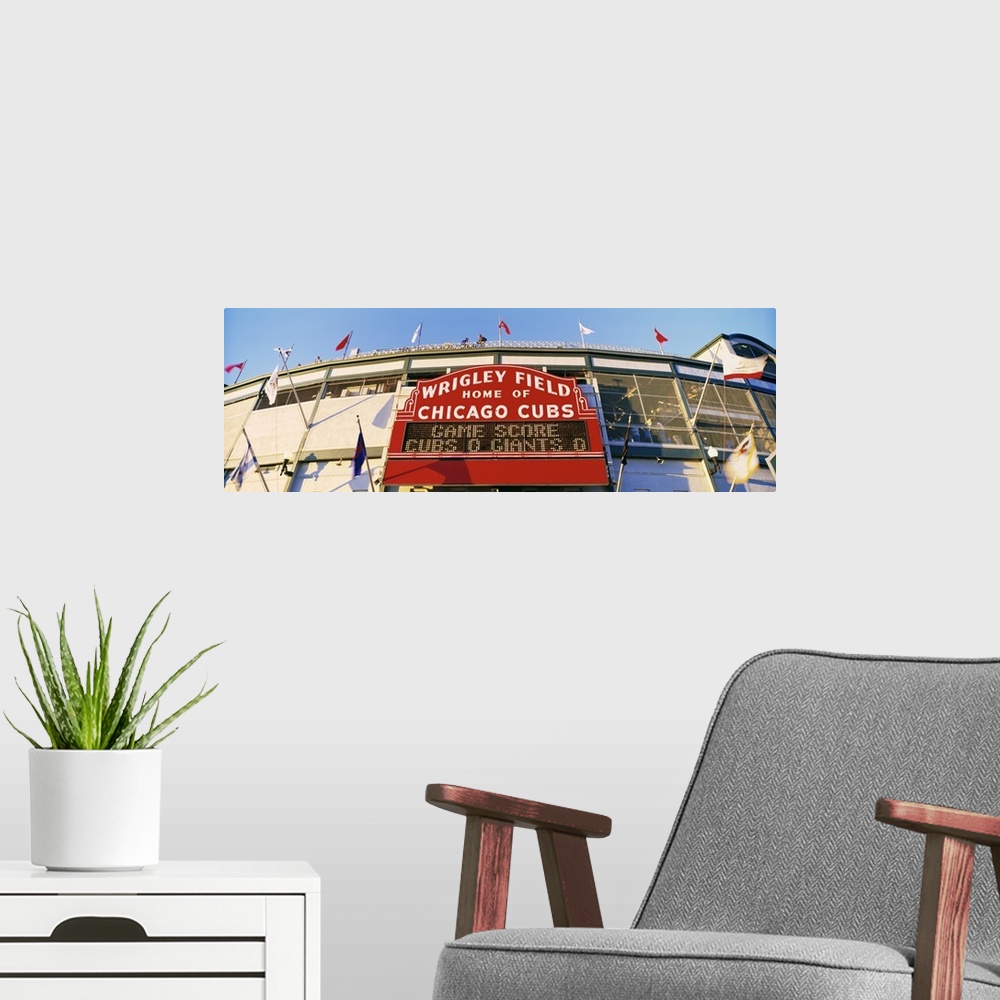 A modern room featuring Panoramic photograph of Chicago Bears baseball stadium entrance.