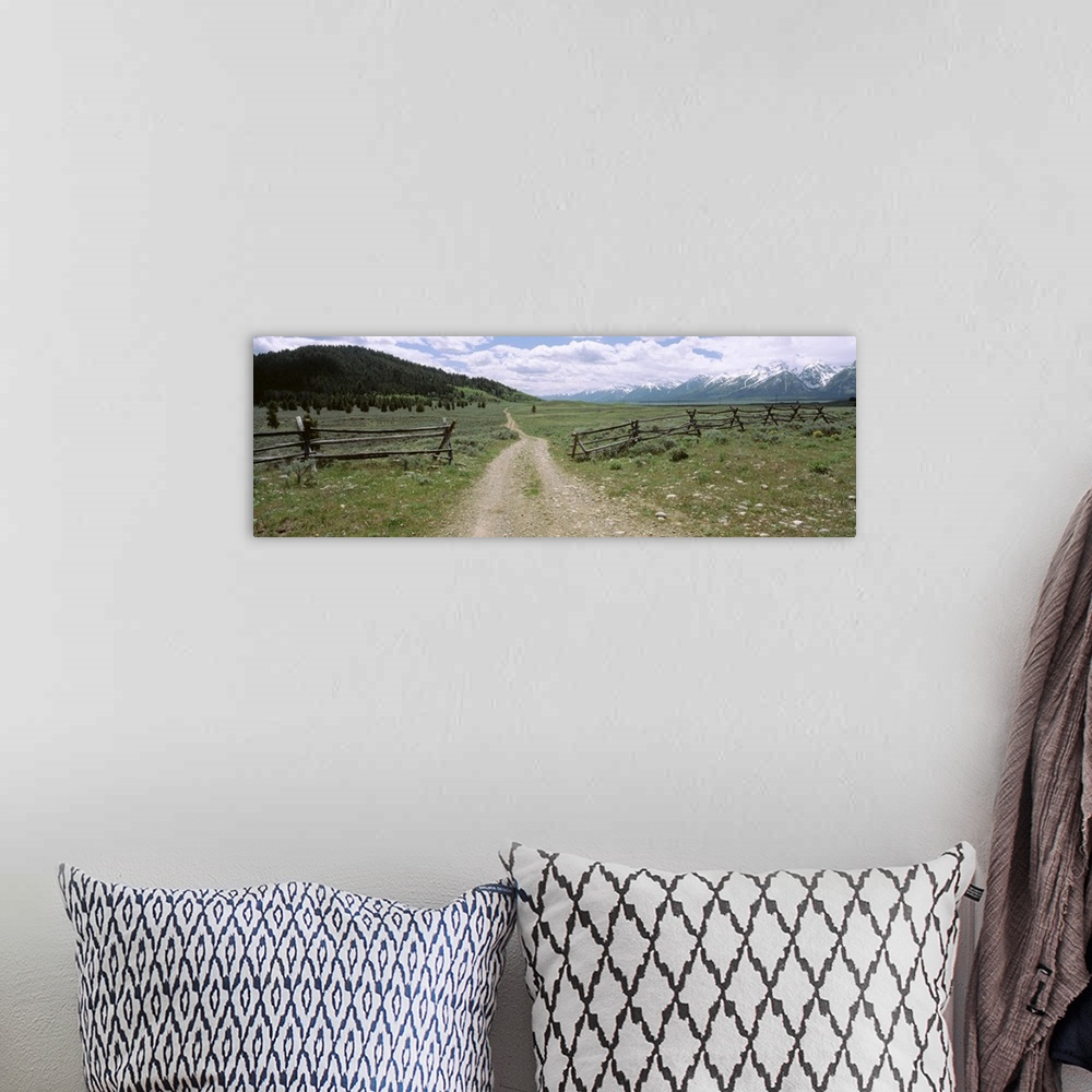 A bohemian room featuring Wyoming, Grand Teton National Park, Dirt road in a landscape