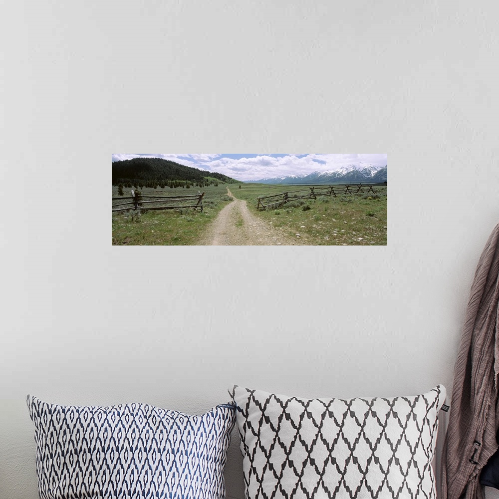 A bohemian room featuring Wyoming, Grand Teton National Park, Dirt road in a landscape