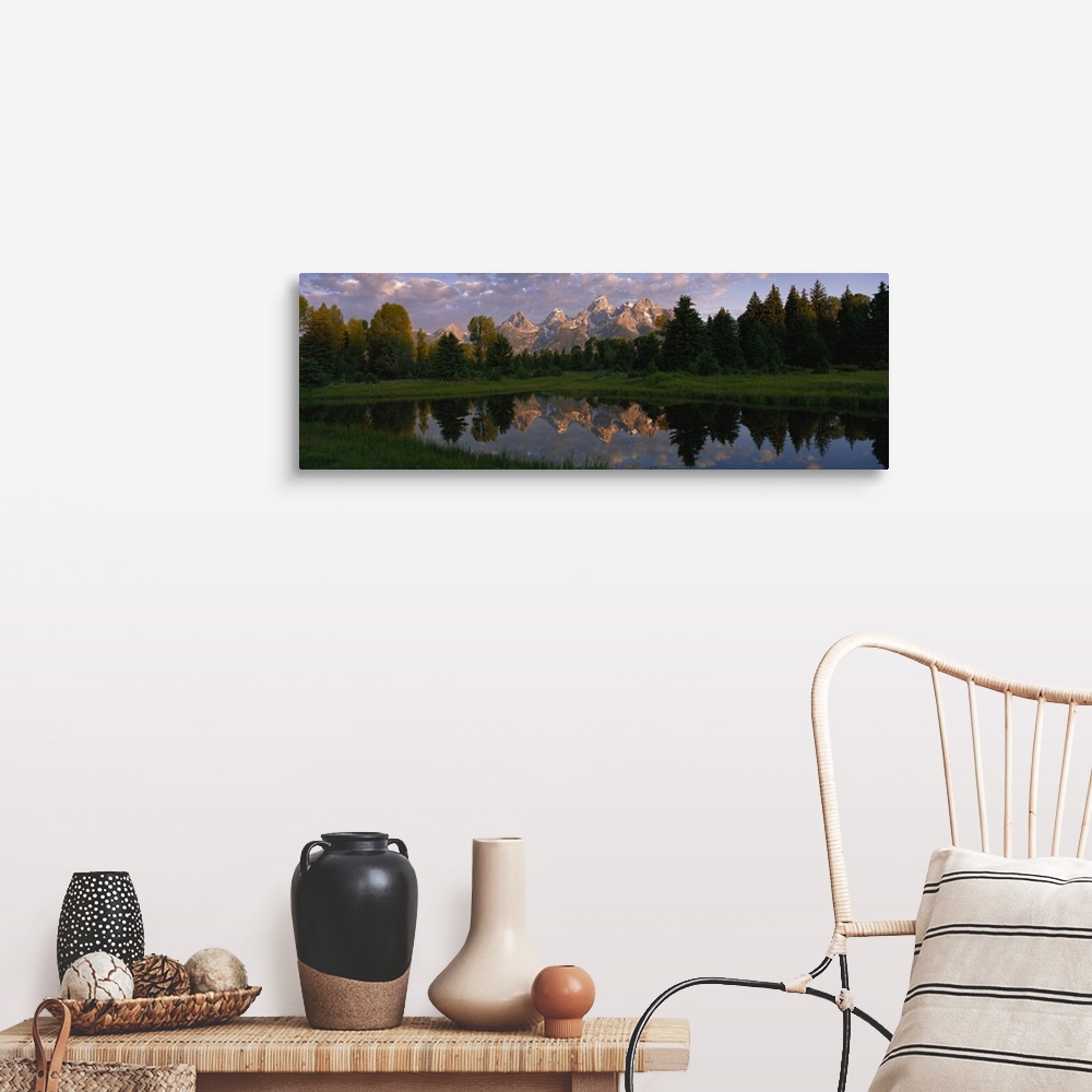 A farmhouse room featuring Panoramic photograph of lake with forest in the background and snow covered mountains in the dist...