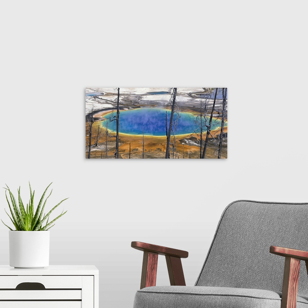 A modern room featuring Wyoming, Yellowstone National Park, Grand Prismatic Pool, Tourists walking around the thermal pool