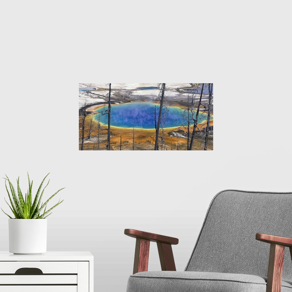 A modern room featuring Wyoming, Yellowstone National Park, Grand Prismatic Pool, Tourists walking around the thermal pool