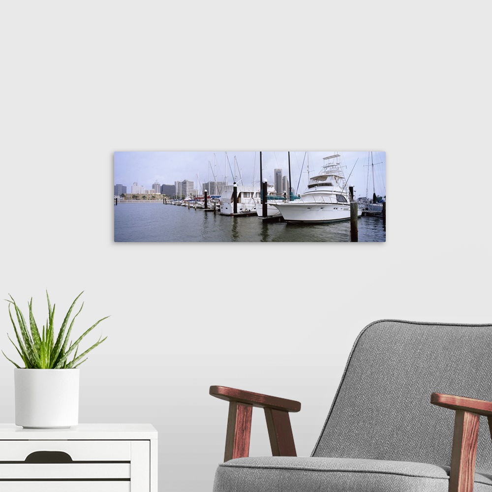 A modern room featuring Yachts at a harbor with buildings in the background, Corpus Christi, Texas