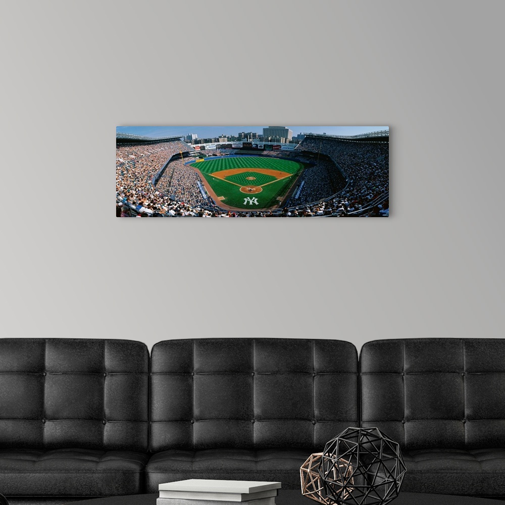 A modern room featuring Panoramic photograph taken at Yankee Stadium in the Bronx, New York displays fans enjoying a base...