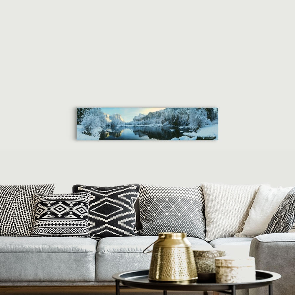 A bohemian room featuring Giant, panoramic photograph of calm waters surrounded by snow covered trees and mountains in Yose...