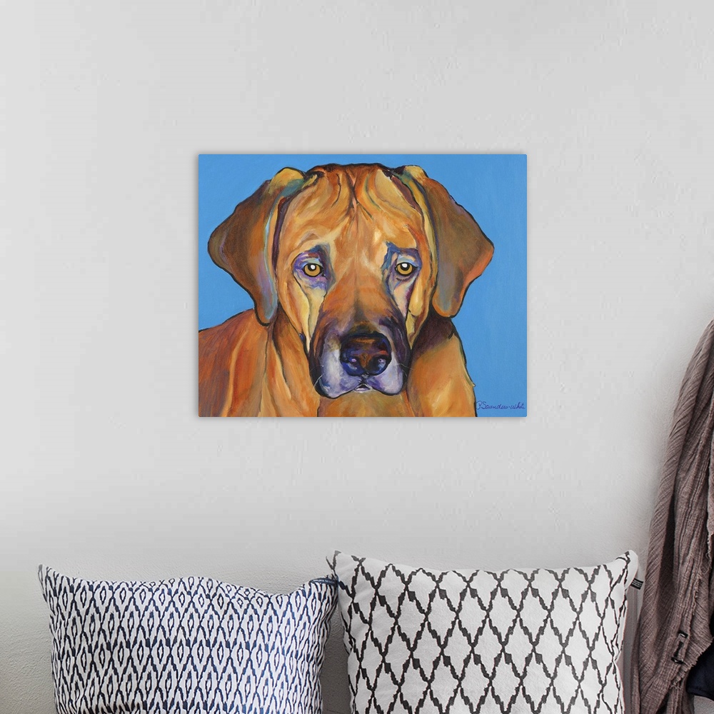 A bohemian room featuring A painting of a dog whose eyes and demeanor appear sad.