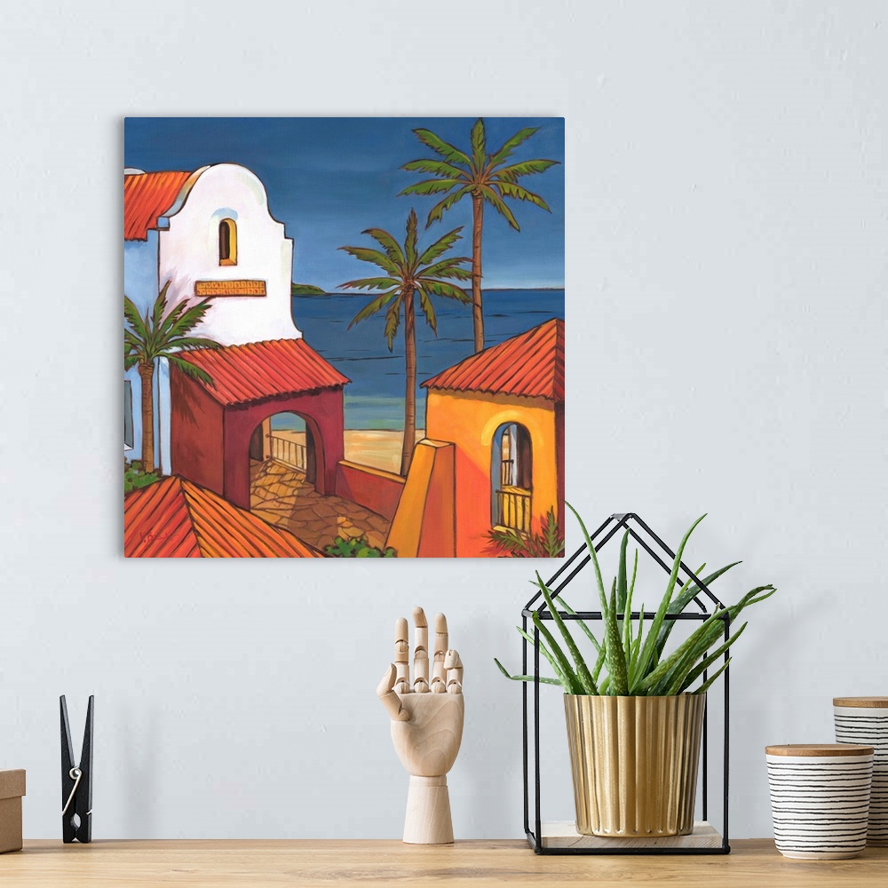 A bohemian room featuring Painting of adobe buildings and palm trees in Antigua, looking out to the sea.