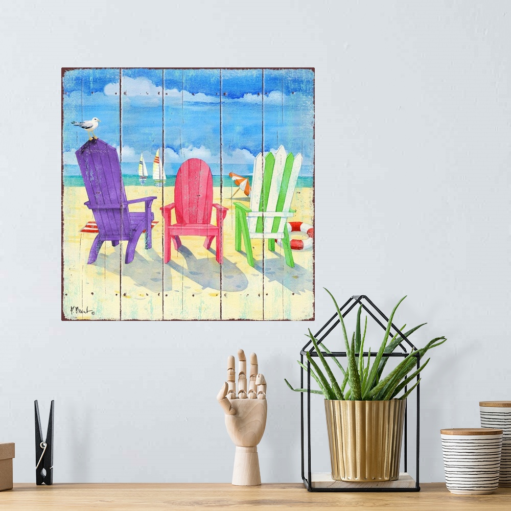 A bohemian room featuring Square decor of colorful beach chairs set up in the sand with the ocean in the background.
