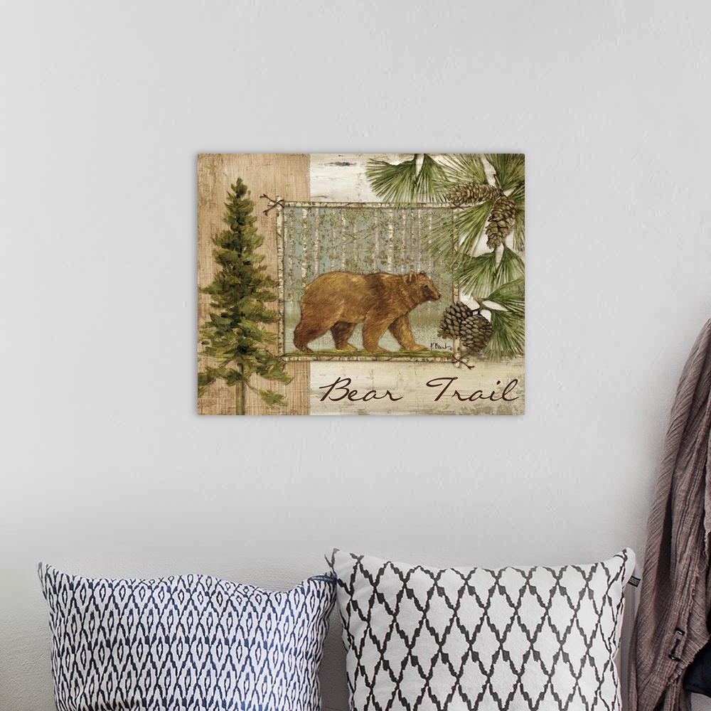 A bohemian room featuring Decorative artwork of a bear in a frame, with pine trees, pinecones, and the words Bear Trail.